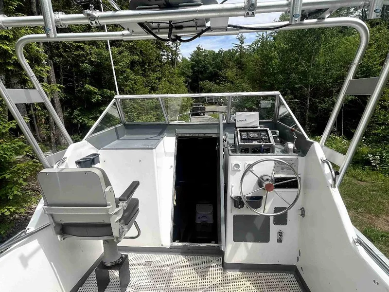 Slide: The Image of 1990 MTI 26-Foot US NAVY Personnel Boat cockpit with steering wheel and control panel. - 20