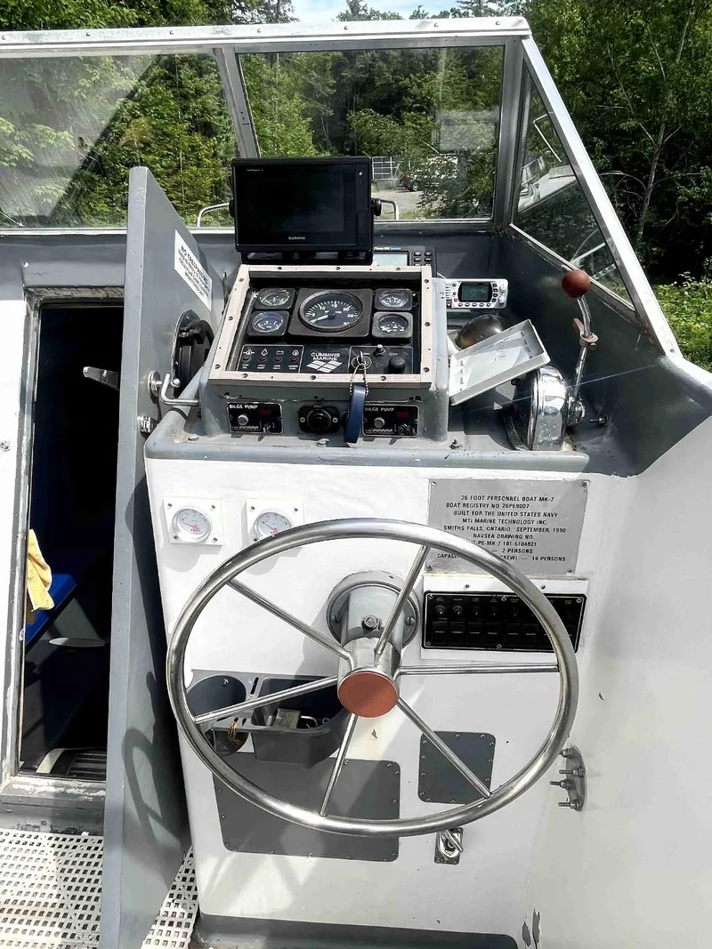 Slide: The Image of 1990 MTI 26-Foot US NAVY Personnel Boat cockpit with steering wheel and control panel. - 21