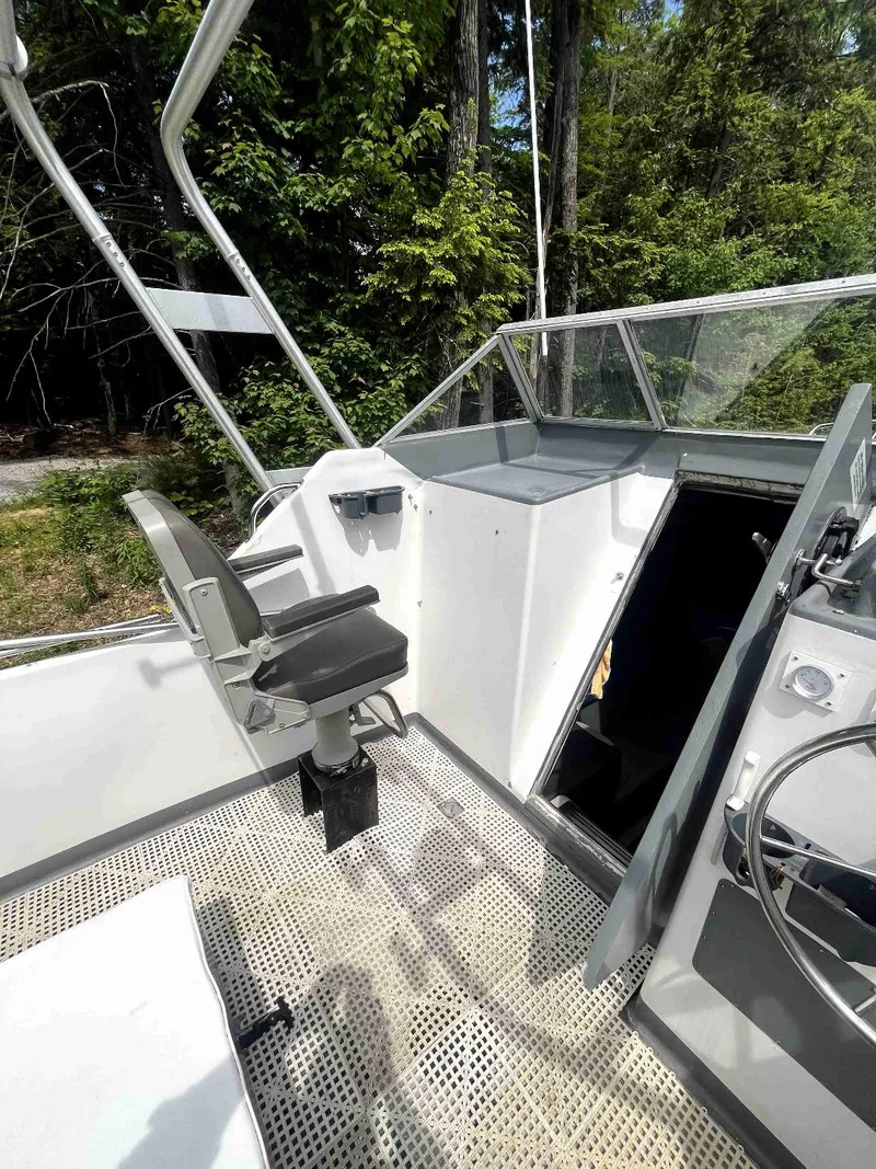 Slide: The Image of 1990 MTI 26-Foot US NAVY Personnel Boat cockpit with seating and controls. - 22