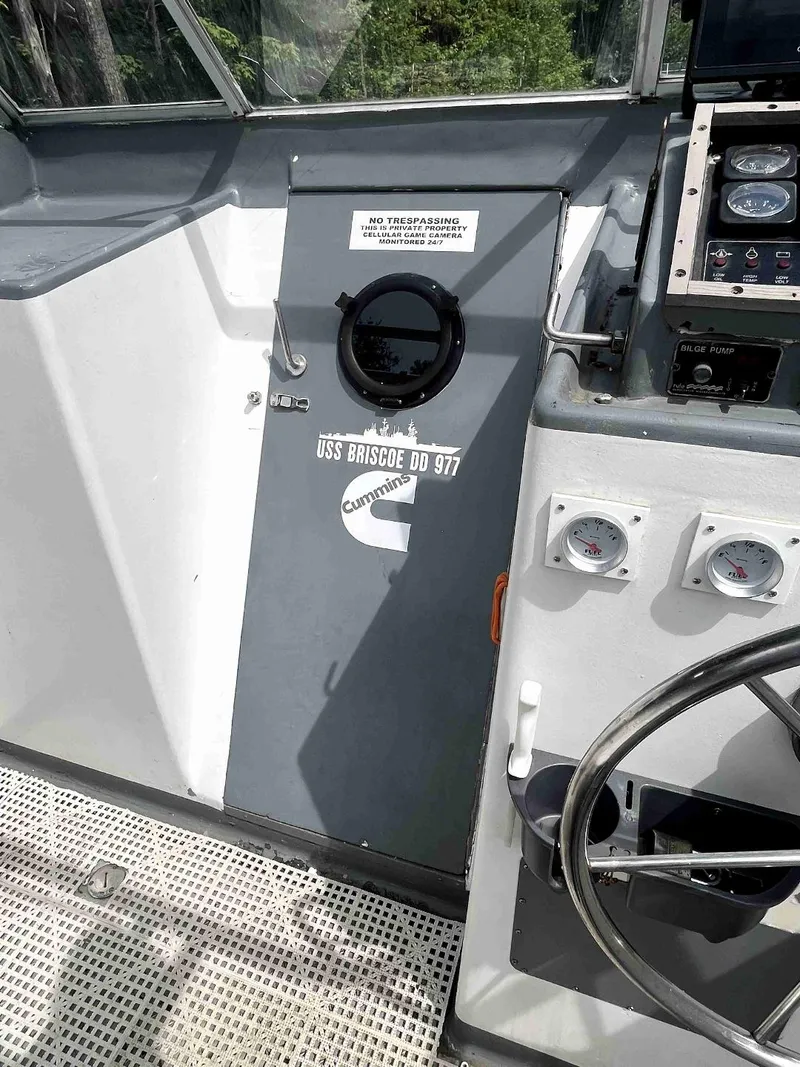 Slide: The Image of 1990 MTI 26-Foot US NAVY Personnel Boat interior with control panel and gauges. - 24