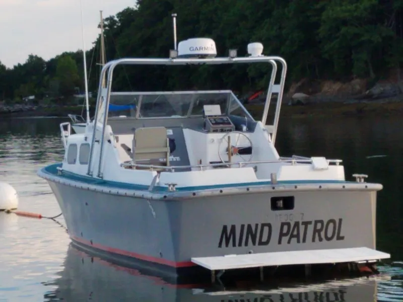 Slide: The Image of 1990 MTI 26-Foot US Navy Personnel Boat named Mind Patrol docked on calm water. - 3