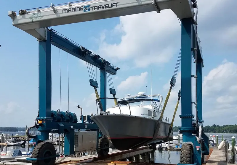 Slide: The Image of 1990 MTI 26-Foot US NAVY Personnel Boat being lifted by Marine Travelift. - 43