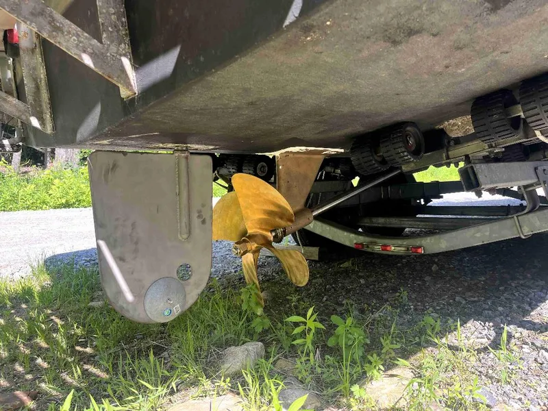 Slide: The Image of Propeller and rudder of a 1990 MTI 26-Foot US NAVY Personnel Boat on a trailer. - 48
