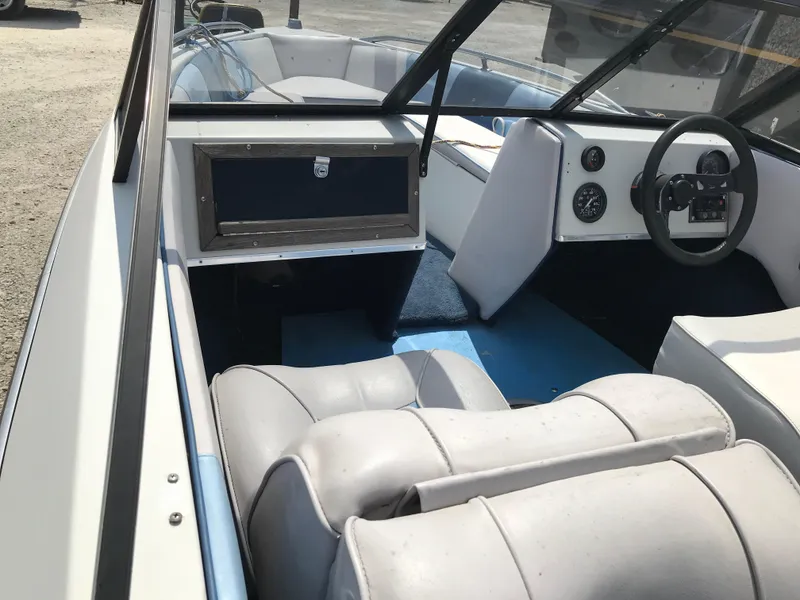 Slide: The Image of 1990 Sea Sprite 155BR boat interior with steering wheel and seating. - 19