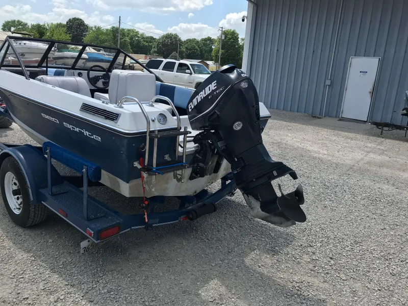 Slide: The Image of 1990 Sea Sprite 155BR boat with Evinrude outboard motor on trailer. - 5