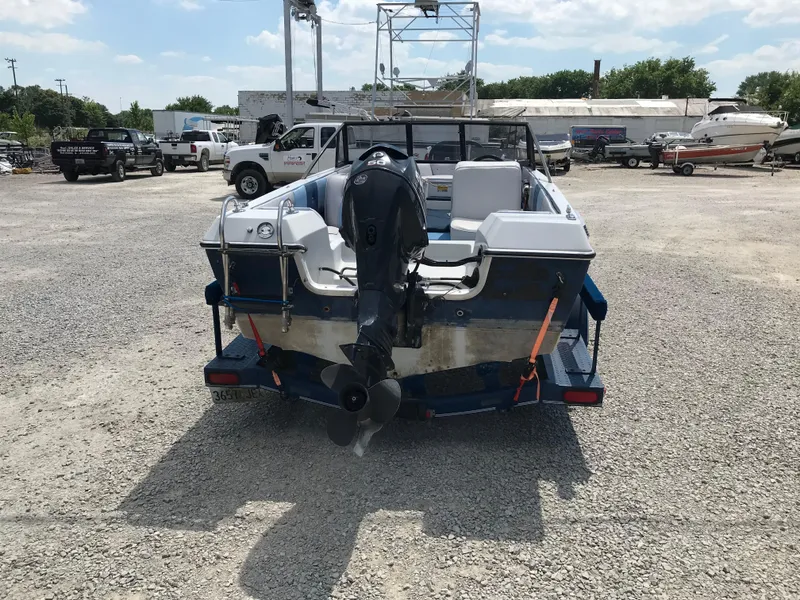 Slide: The Image of 1990 Sea Sprite 155BR boat on trailer, rear view in a boatyard. - 6