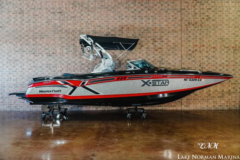 Slide: The Image of 2014 MasterCraft XStar boat displayed at Lake Norman Marina. - 1