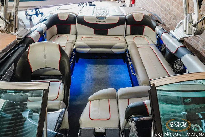 Slide: The Image of 2014 MasterCraft XStar interior with spacious seating and modern design. - 15