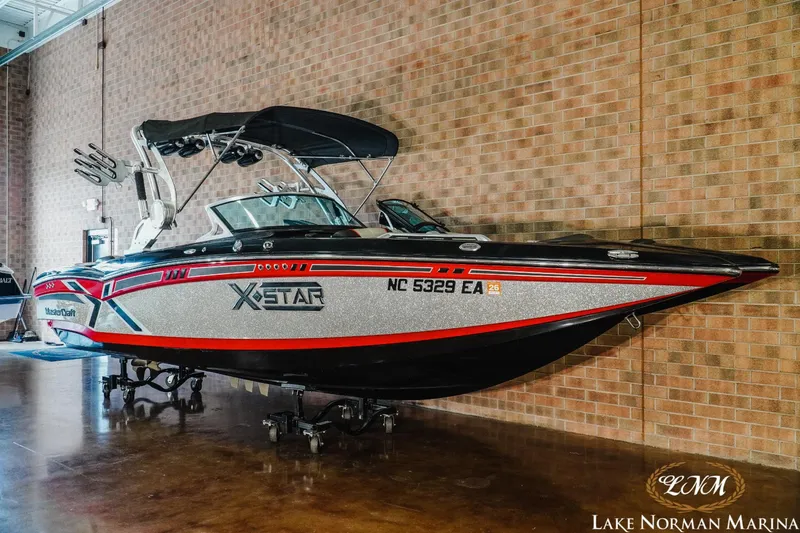 Slide: The Image of 2014 MasterCraft XStar boat at Lake Norman Marina. - 3