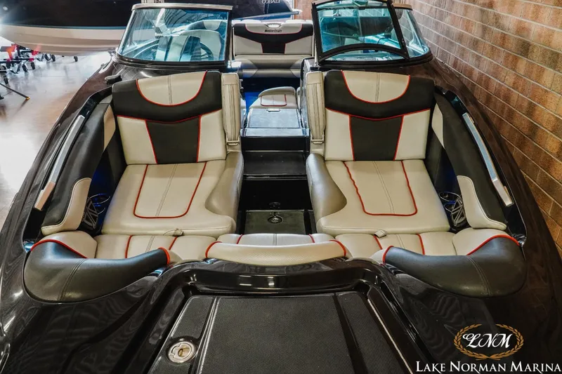 Slide: The Image of 2014 MasterCraft XStar boat interior with luxurious seating at Lake Norman Marina. - 7