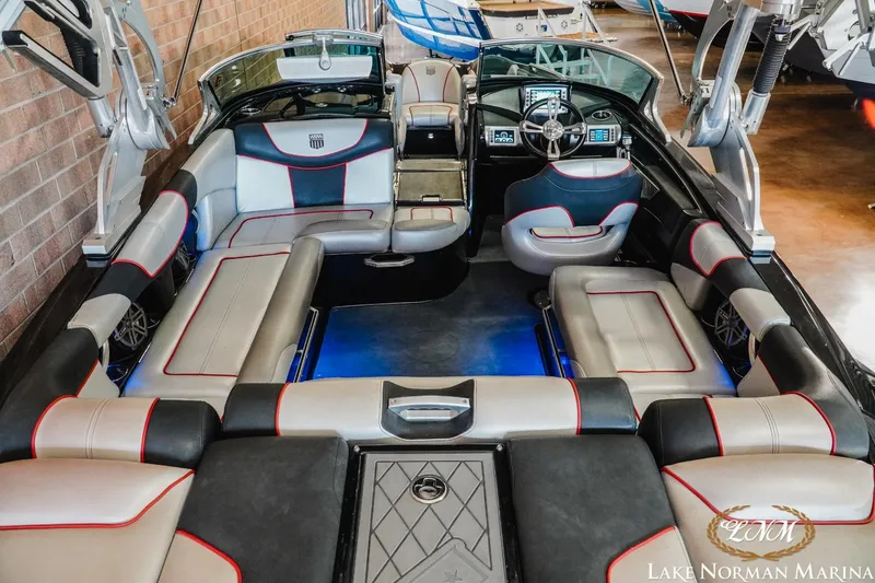 Slide: The Image of 2014 MasterCraft XStar interior with spacious seating and modern dashboard at Lake Norman Marina. - 8