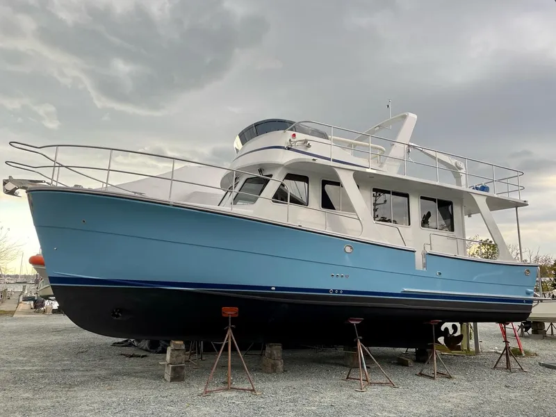 Slide: The Image of 2024 Helmsman Trawlers 38 Sedan on a dry dock. - 20