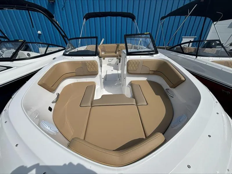Slide: The Image of 2024 Bayliner VR6 boat with tan seating and open bow design. - 9
