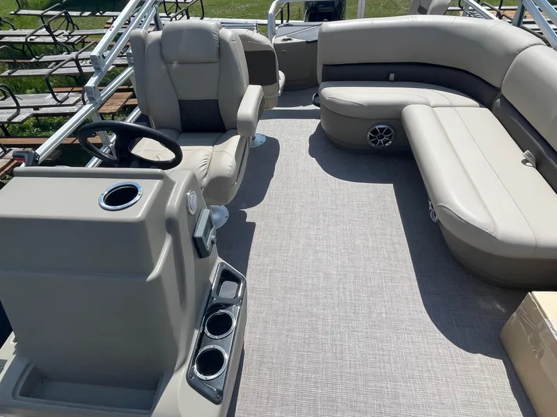 Slide: The Image of 2024 Sun Tracker Bass Buggy 18 DLX interior with seating and steering console. - 10