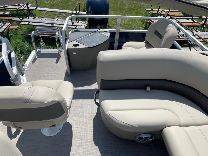 Slide: The Image of 2024 Sun Tracker Bass Buggy 18 DLX pontoon boat interior with seating and storage. - 15