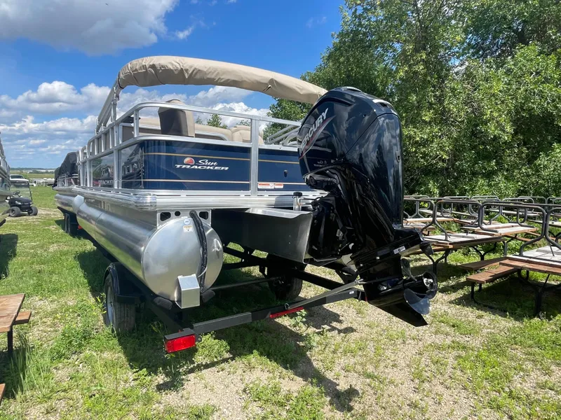 Slide: The Image of 2024 Sun Tracker Bass Buggy 18 DLX pontoon boat with outboard motor. - 4