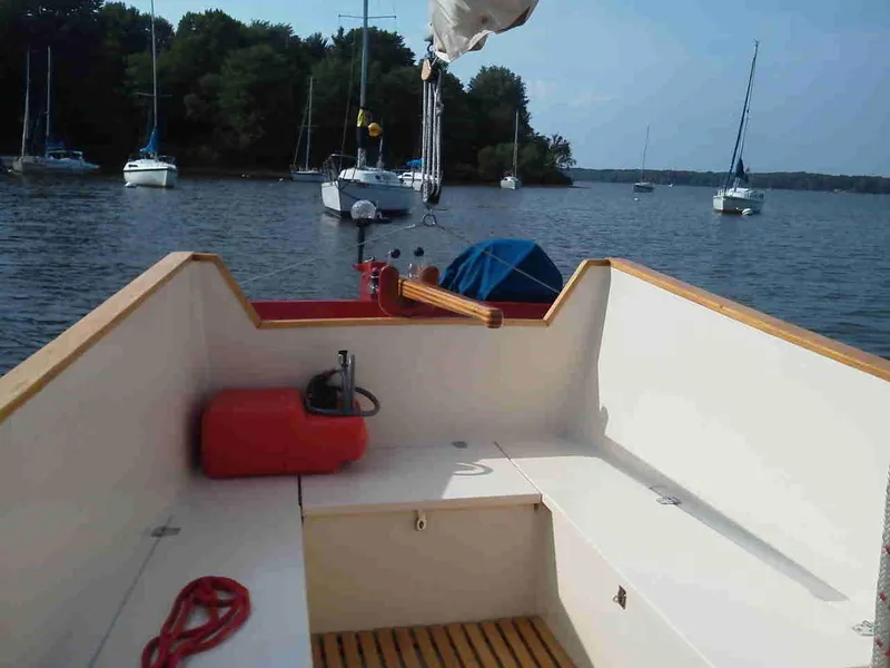 Slide: The Image of 2011 Custom Cat Ketch sailboat interior with view of lake and anchored boats. - 6