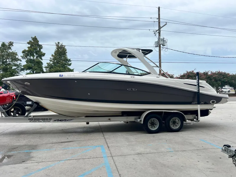 Slide: The Image of 2008 Sea Ray 270 Select EX boat on trailer, parked outdoors. - 4