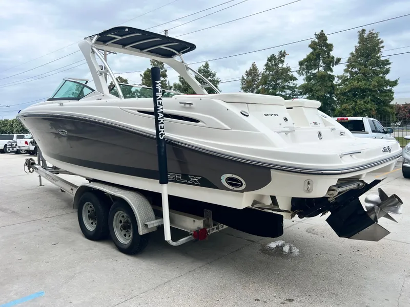 Slide: The Image of 2008 Sea Ray 270 Select EX boat on trailer, parked outdoors. - 5
