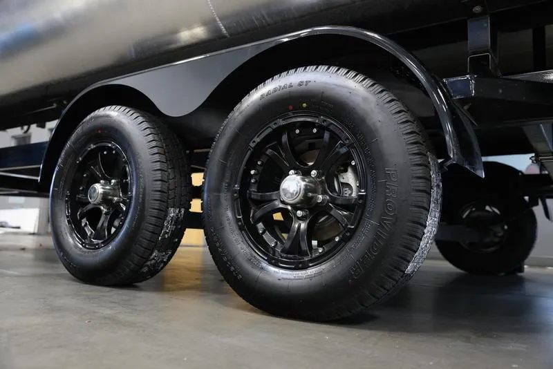 Slide: The Image of 2024 Barletta ARIA A20UC trailer wheels, black alloy rims, close-up view. - 13