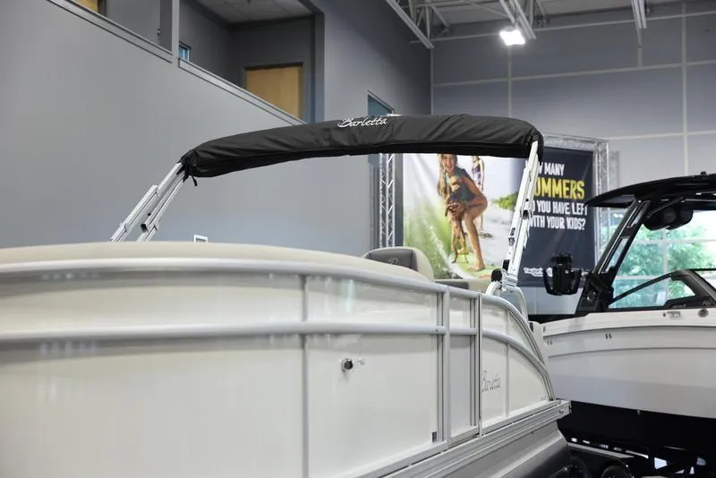 Slide: The Image of 2024 Barletta ARIA A20UC pontoon boat on display in showroom. - 17