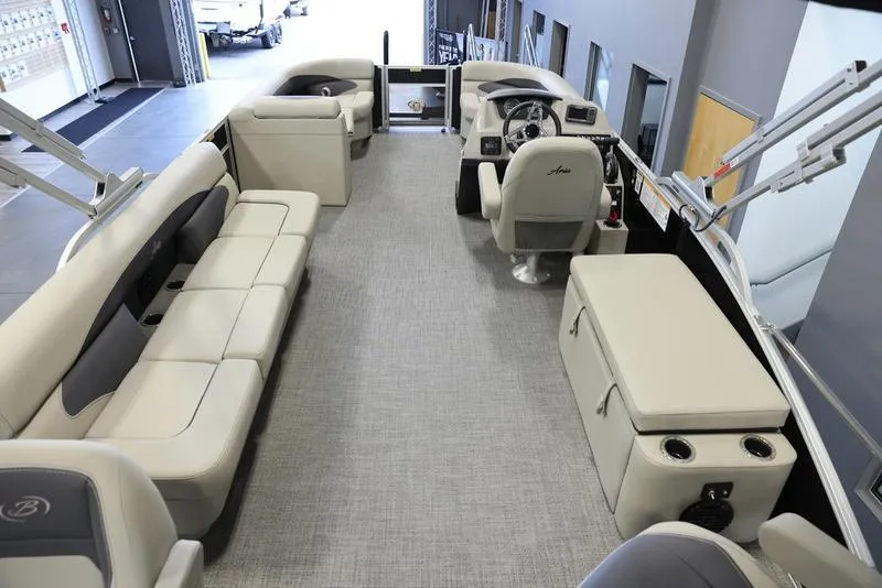 Slide: The Image of 2024 Barletta Aria A22CC pontoon boat interior with spacious seating and modern helm. - 11