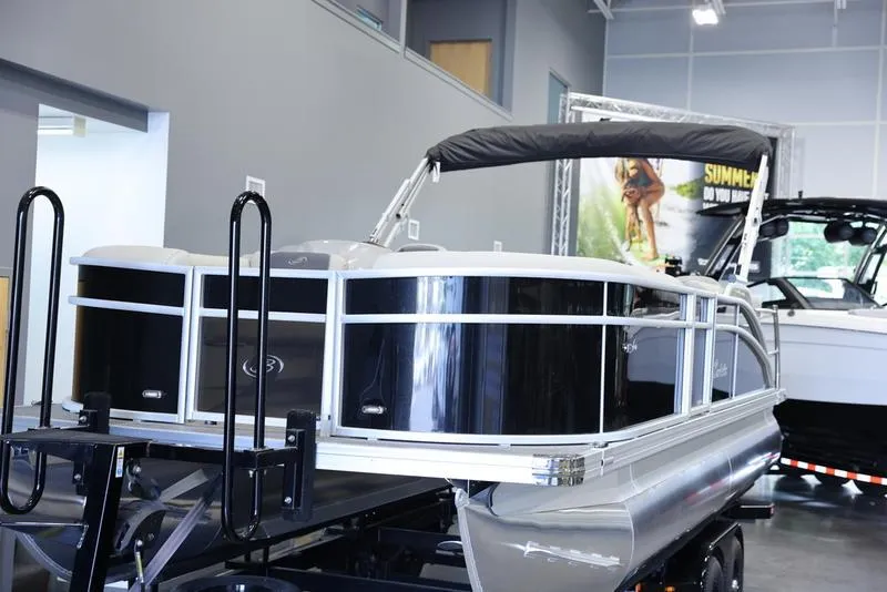 Slide: The Image of 2024 Barletta Aria A22CC pontoon boat on display in showroom. - 16