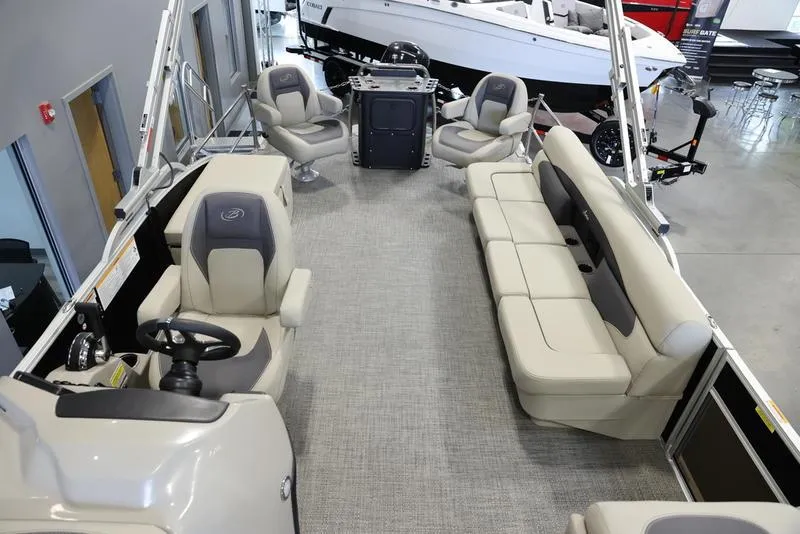 Slide: The Image of 2024 Barletta Aria A22CC pontoon boat interior with plush seating and modern helm. - 17