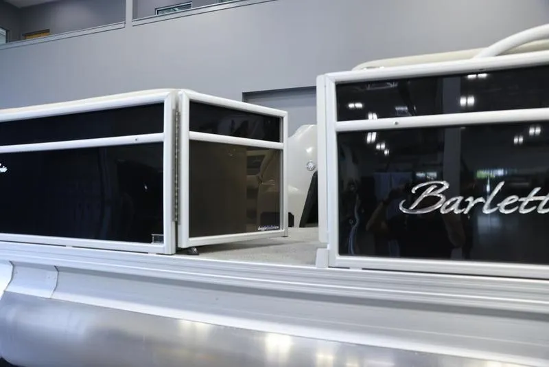 Slide: The Image of 2024 Barletta Aria A22CC pontoon boat, side view in showroom. - 6