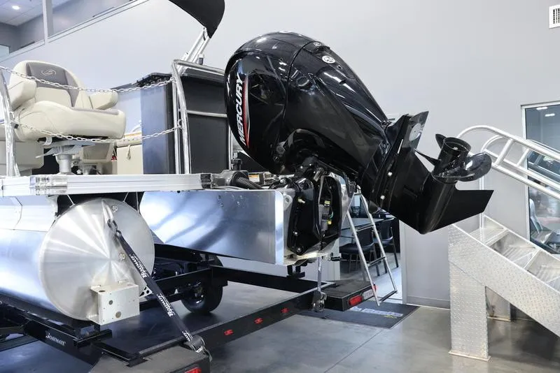 Slide: The Image of 2024 Barletta Aria A22CC pontoon boat with Mercury outboard motor in showroom. - 9
