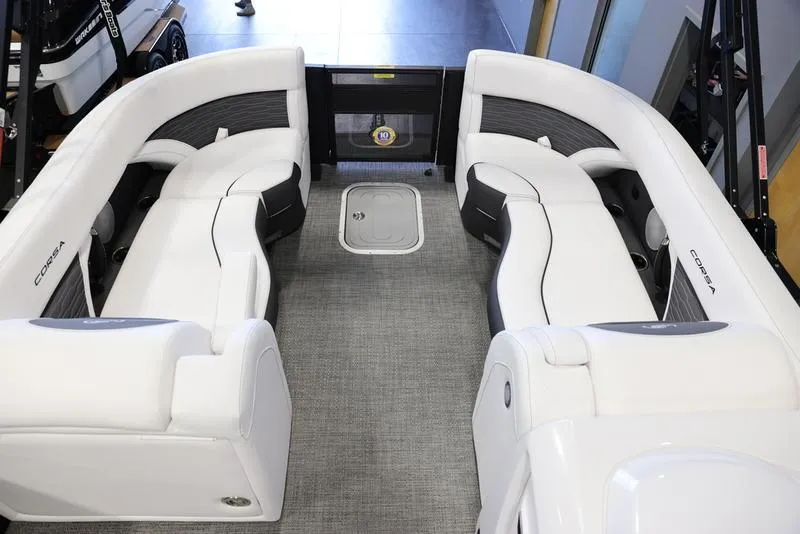 Slide: The Image of 2024 Barletta CORSA 25UE boat interior with white seating and gray flooring. - 14