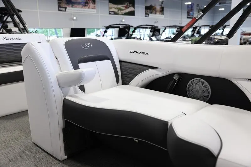 Slide: The Image of 2024 Barletta CORSA 25UE boat interior with white and black seating. - 17