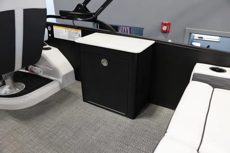 Slide: The Image of 2024 Barletta CORSA 25UE interior, featuring seating and storage compartment. - 20