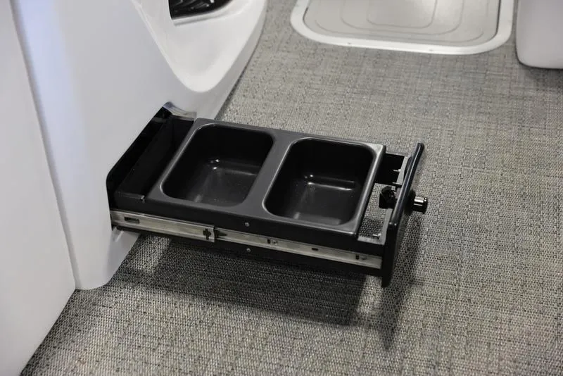 Slide: The Image of 2024 Barletta CORSA 25UE retractable dual cup holder on carpeted floor. - 3