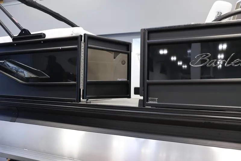 Slide: The Image of 2024 Barletta CORSA 25UE pontoon boat, side view with open gate. - 9