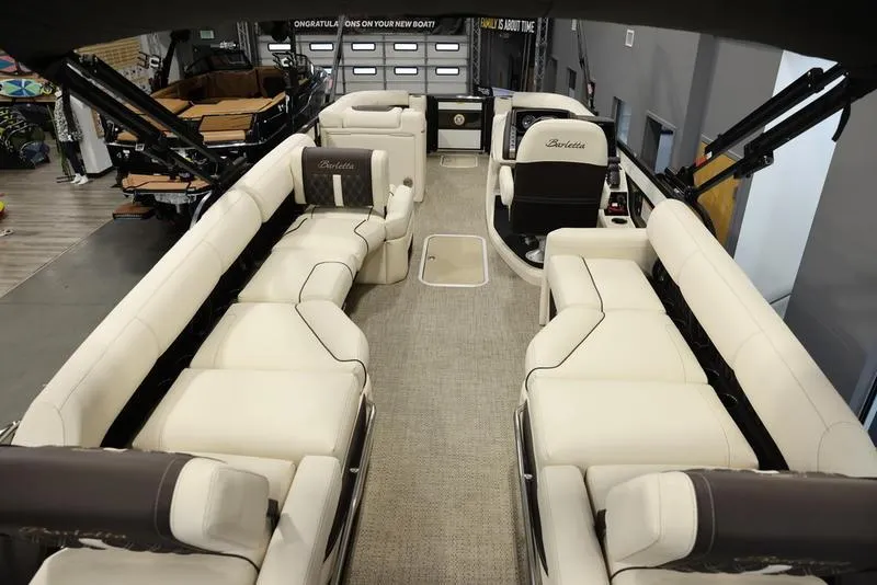 Slide: The Image of 2024 Barletta LUSSO L25M pontoon boat interior with luxurious seating. - 16