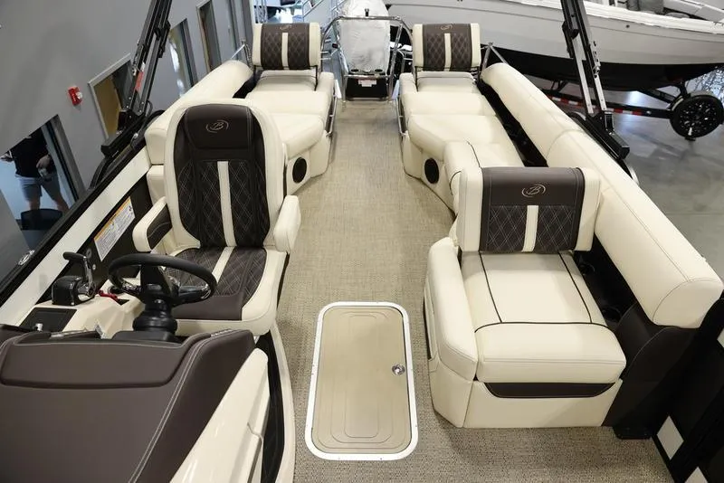 Slide: The Image of 2024 Barletta LUSSO L25M luxury pontoon boat interior with plush seating and modern design. - 23