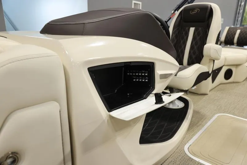 Slide: The Image of 2024 Barletta LUSSO L25M boat interior with open storage compartment and luxurious seating. - 27