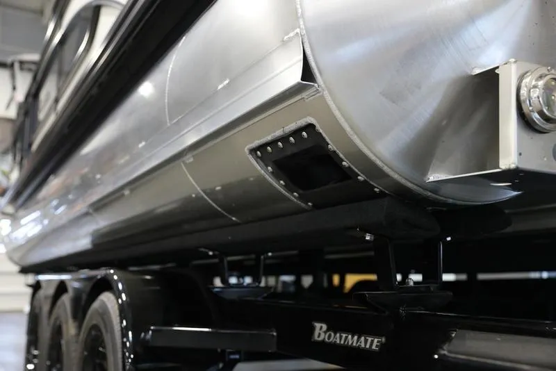 Slide: The Image of 2024 Barletta LUSSO L25M pontoon boat on Boatmate trailer, close-up view. - 4