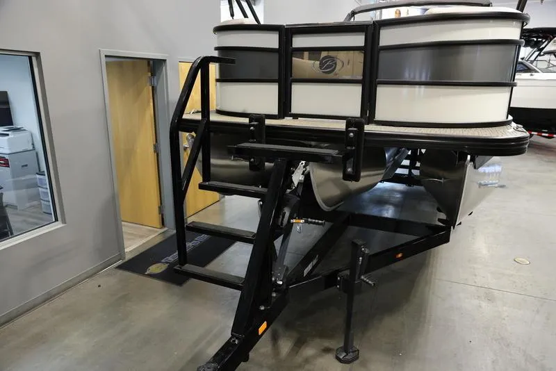 Slide: The Image of 2024 Barletta LUSSO L25M pontoon boat on trailer in showroom. - 9