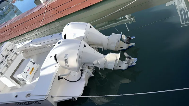 Slide: The Image of 2017 Jupiter 32 Cuddy Cabin with twin Yamaha outboard engines docked. - 5