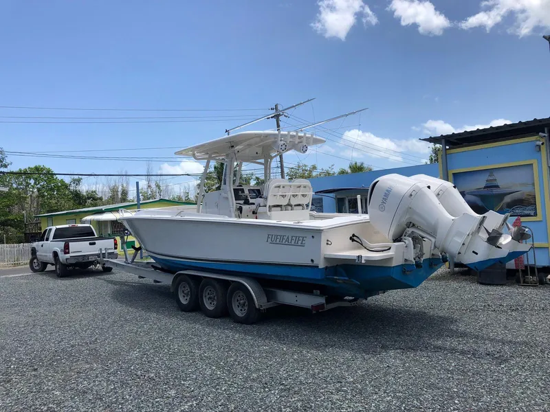 Slide: The Image of 2017 Jupiter 32 Cuddy Cabin boat on a trailer, ready for transport. - 6