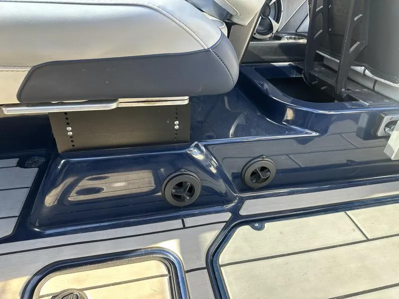 Slide: The Image of 2024 Malibu 23 MXZ boat interior seating and deck details. - 12