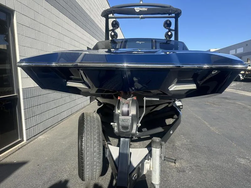 Slide: The Image of 2024 Malibu 23 MXZ boat on a trailer, front view. - 13
