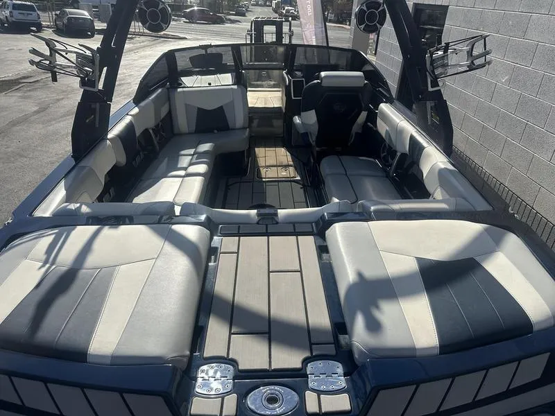 Slide: The Image of 2024 Malibu 23 MXZ boat interior with spacious seating and modern design. - 5