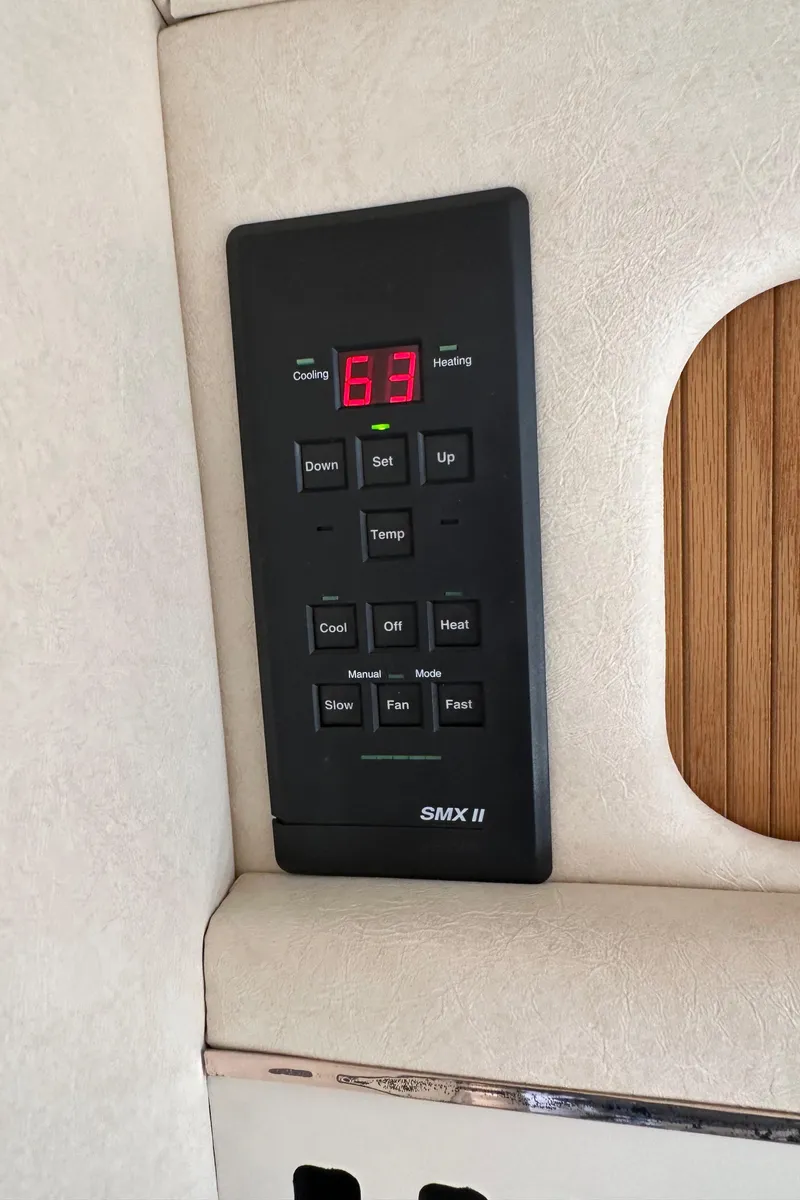 Slide: The Image of Digital control panel on 1999 Sea Ray 310 Sundancer boat interior. - 22