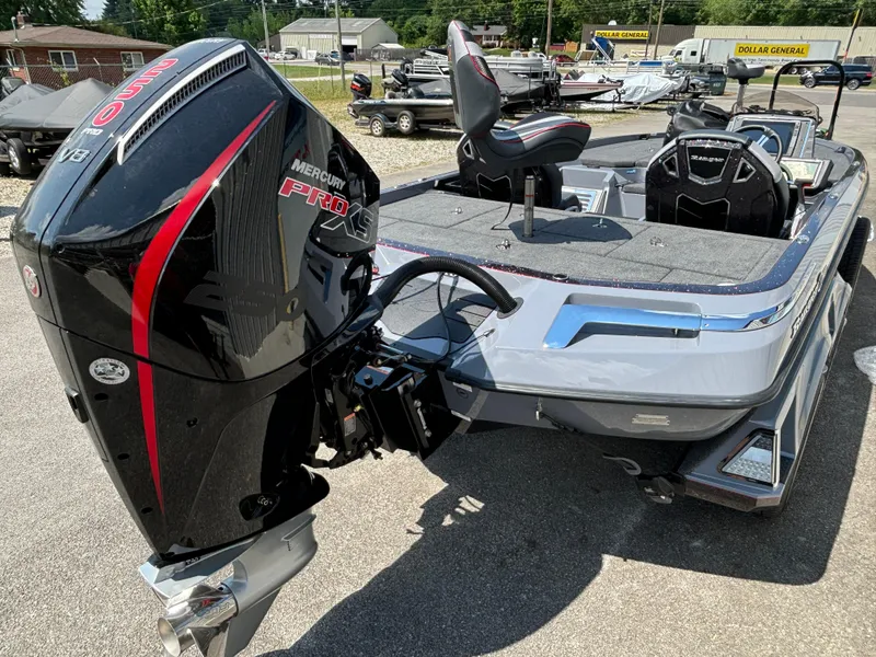 Slide: The Image of 2025 Ranger Z521R boat with Mercury Pro XS engine in a parking lot. - 16