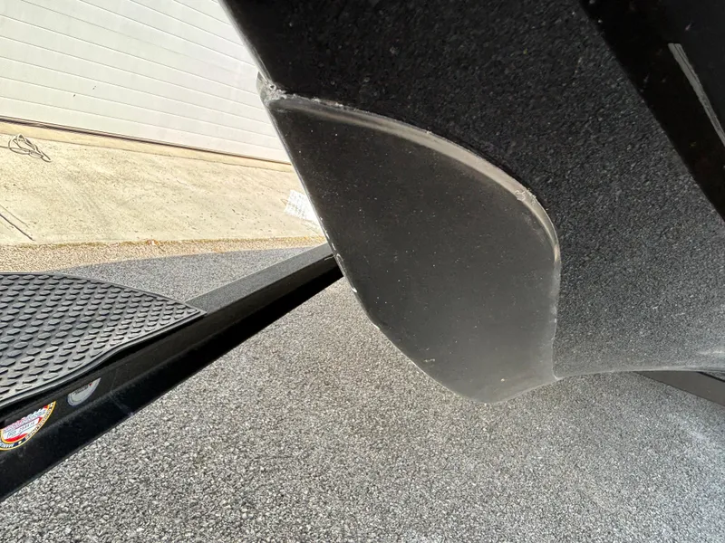 Slide: The Image of 2025 Ranger Z521R boat hull and trailer close-up. - 2