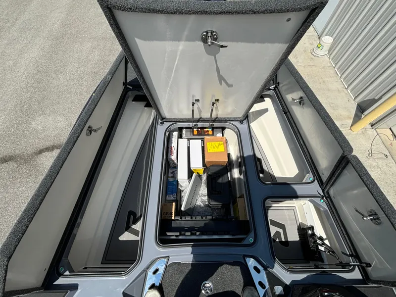 Slide: The Image of Open storage compartments of a 2025 Ranger Z521R boat. - 7
