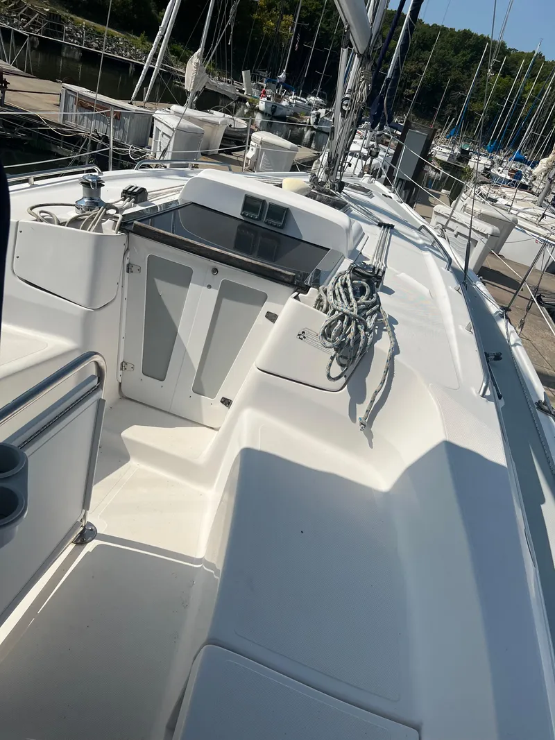Slide: The Image of 2009 Hunter 36 sailboat deck with ropes and control panel. - 2